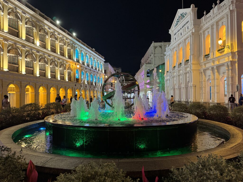 Senado Square with buildings and fountain. 