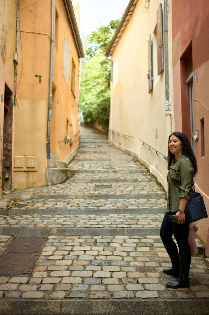 woman walking up a steep alleyway