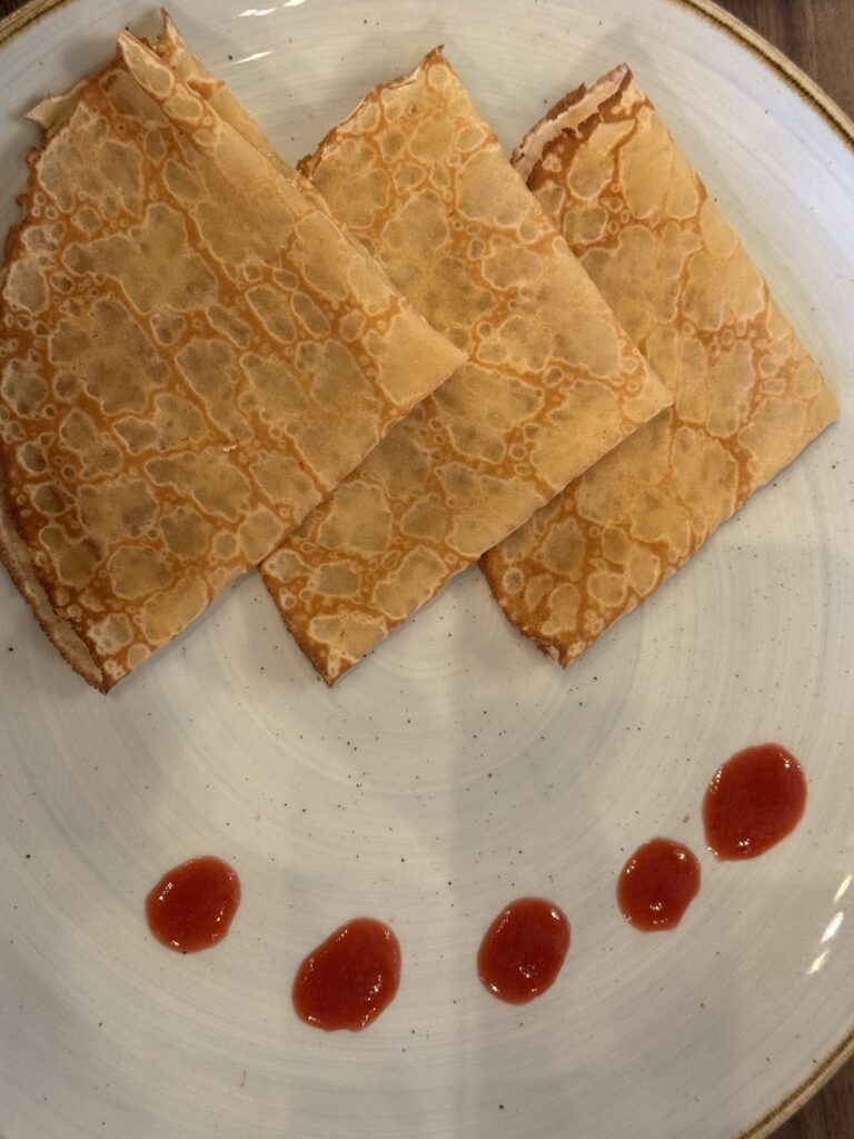 crepes on a plate at the restaurant le train bleu in paris france 