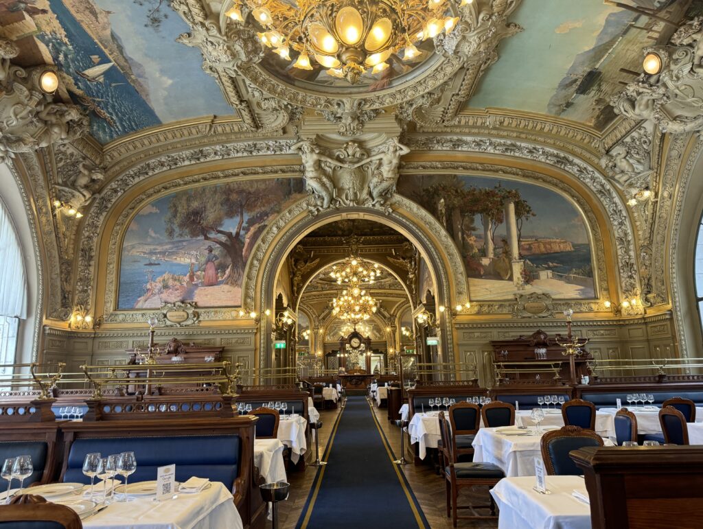 inside a restaurant with painted ceilings 