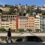 Man walking by the canals in Lyon.