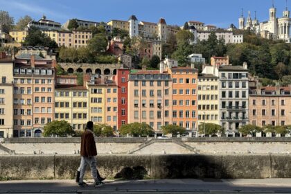 Man walking by the canals in Lyon.